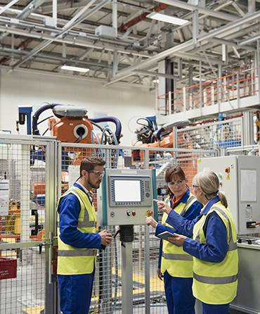 People having Machine Safely Meeting in front of robot work cell